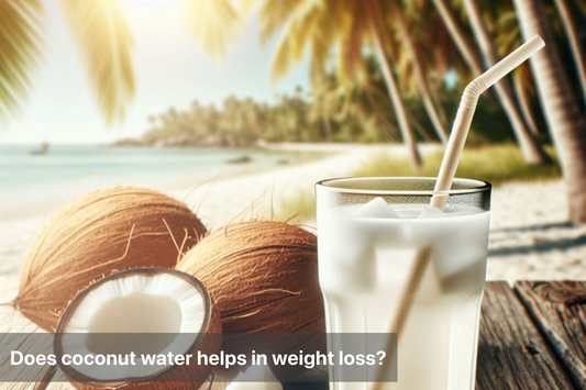 A glass of refreshing coconut water with ice and a straw, surrounded by coconuts on a beach