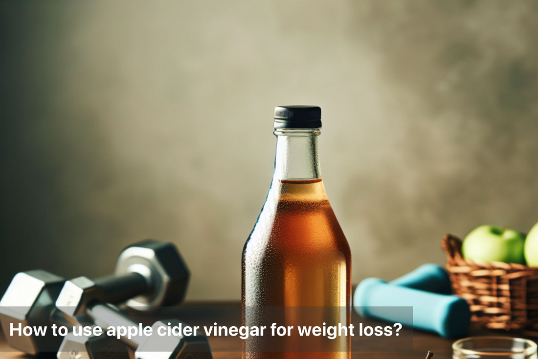 Bottle of apple cider vinegar with dumbbells and apples in the background